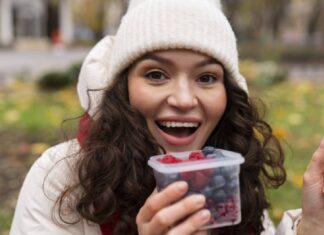 Eat these winter fruits to boost immunity A girl eating berries