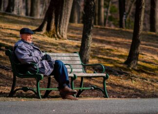 Are states prepared for populations of lower-income older adults? an older adult sitting on a park bench