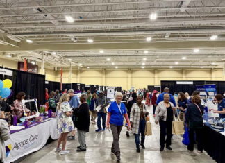 MUSC’s Senior Expo draws crowd to learn about healthy aging | MUSC People in a large room walk around to booths.